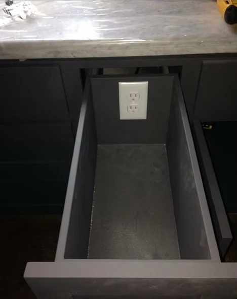 New outlet installed and tested inside a cabinet for a built-in appliance